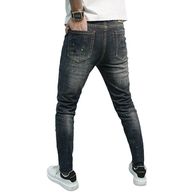Herren Skinny Fit Jeans im kreativen Rissdesign und bunten Farbsklecks Heidi-Mode - Image 5